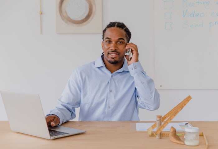 Business owner checking in with a client after automation went live