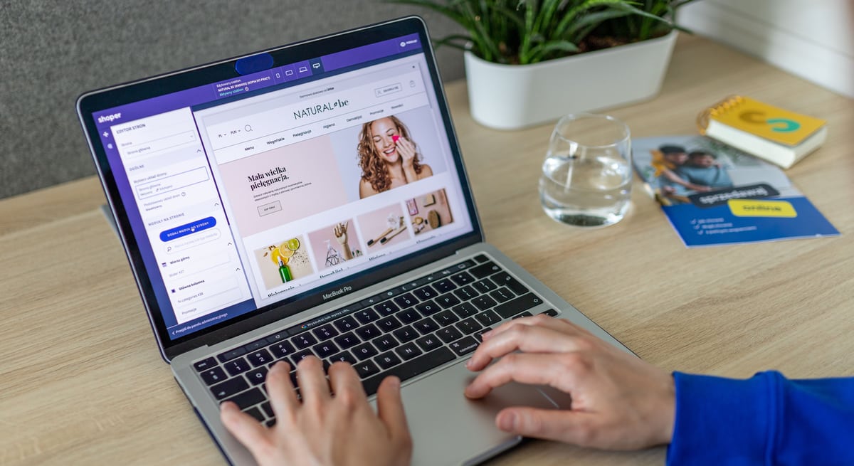A website builder open on a laptop, editing a live storefront design